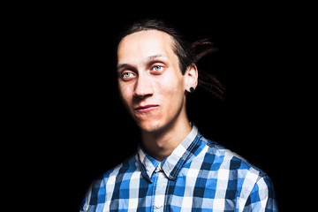 Portrait of young cool man with dreadlocks