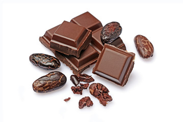 Close-up pieces of dark chocolate bar with cocoa beans