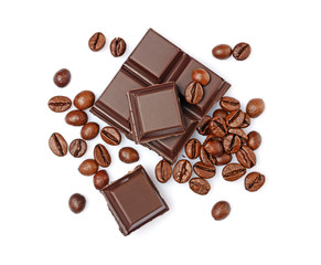 Close-up pieces of dark chocolate bar with coffee flavor and beans