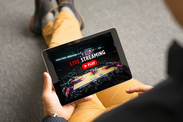 Fototapeta premium Man watching sports on live streaming online service