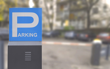 Parking blue lot sign with blured paring background