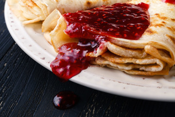 Russian blini pancakes and berry jam. Maslenitsa is an Eastern Slavic traditional holiday