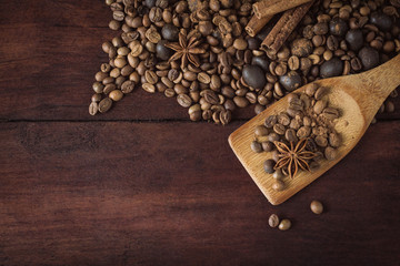 Coffee Beans, Chocolate Balls, Spices, Cinnamon on the Old Wooden Table. Flat lay, top view