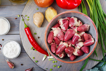 Raw chicken hearts. Ingredients for cooking stir-fry and buckwheat noodles. Chinese cuisine. Top view