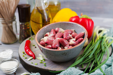 Raw chicken hearts. Ingredients for cooking stir-fry and buckwheat noodles. Chinese cuisine