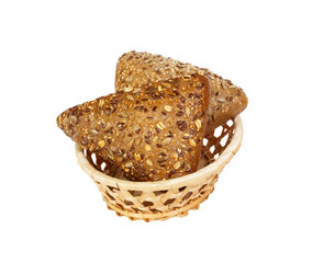 Closeup of rye bread with flax seeds on basket isolated on white background