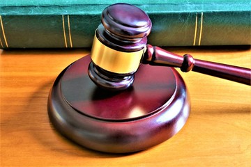 An concept Image of a judge hammer with a book