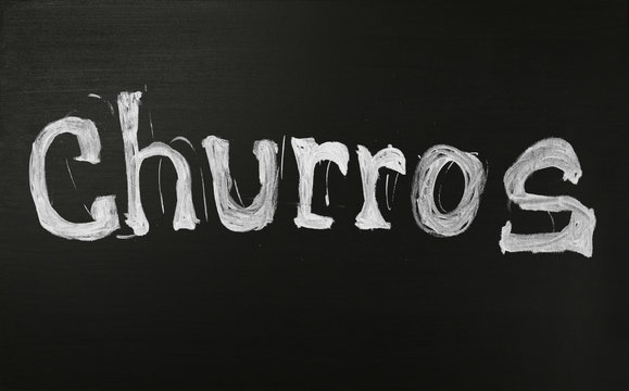 White chalk CHURROS word over black chalkboard