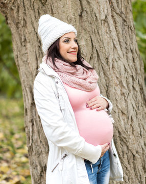 Portrait of smiling pregnant young woman