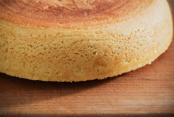 sponge cake on old wooden table.