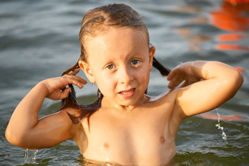 Girl having fun bathing in the sea.