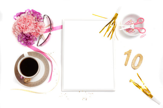 White, gold and pink womens office desk table with a lot of things on it. Top view with copy space.frame