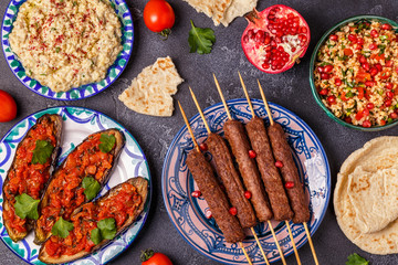 Classic kebabs, tabbouleh salad, baba ganush and baked eggplant with sauce.