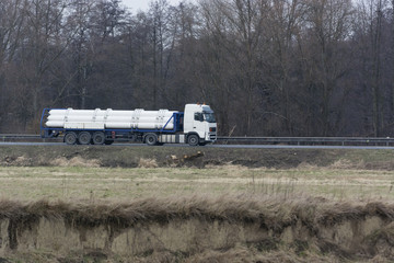 Large truck stretching gas bombs.