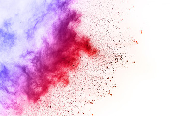 Fototapeta premium Colorful powder explosion on white background.