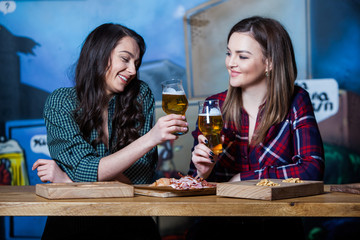 Party girls. Beautiful girls drinking beer.