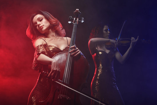 The cellist girl performs on stage.