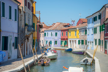 Fototapeta na wymiar Canal in Burano, near Venice, in a sunny day