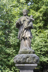 Fototapeta na wymiar Stone statue of Saint.