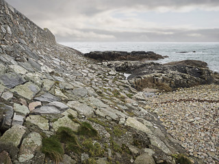 Fototapeta na wymiar Brake water on West coast of Ireland, The Atlantic ocean, Low tide. Structure and texture.
