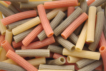 Variegated italian pasta. Colorful dried pasta texture