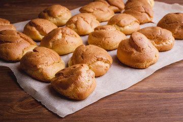 fresh eclairs wooden table