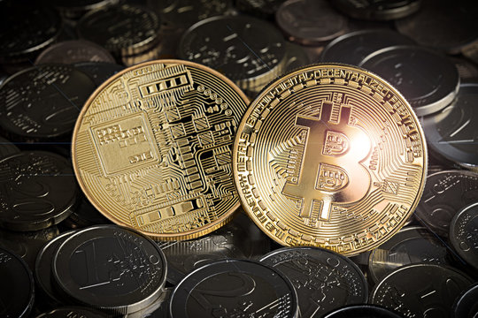 shiny golden bitcoin on stack of euro coins crypto currency concept