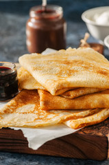 Freshly baked cheesy spinach bread on a white stone backdrop. Rustic style.