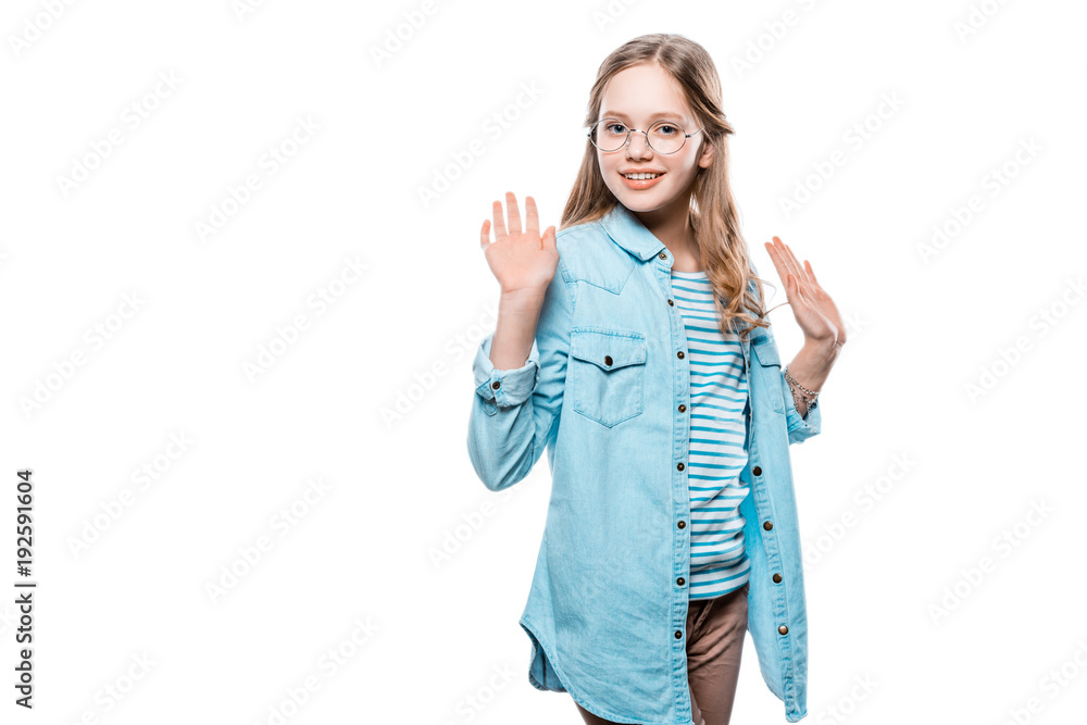 Wall mural cute teenage girl raising hands and smiling at camera isolated on white