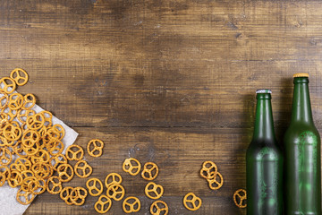Beer and crackers on a wooden table