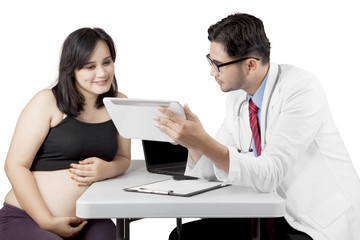 Pregnant woman having a consultation with a gynecologist