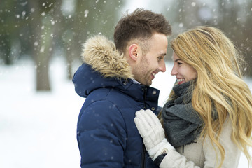 Couple in love in winter scenery

