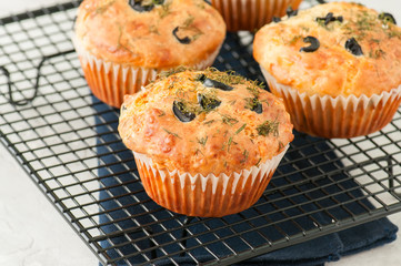 Freshly baked cheesy spinach bread on a white stone backdrop. Rustic style.