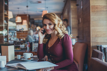 Smiling Woman Cafe Cell. Beautiful Girl with Mobile Phone Resting in Restaurant