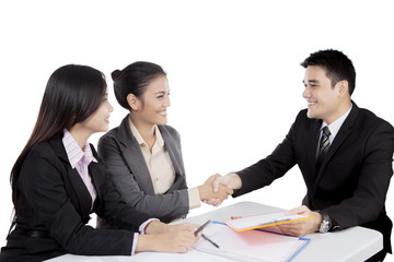 Asian business people handshake in a meeting