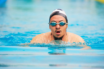 Fototapeta na wymiar Young man swimmer