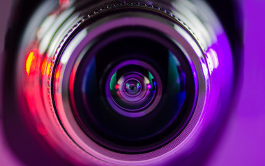 Fototapeta na wymiar The camera lens and light purple-red