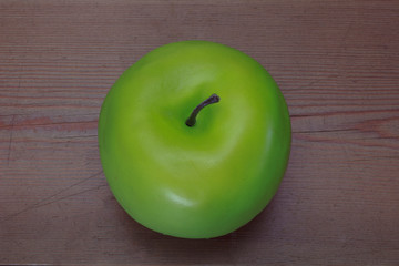 Green apple on a wooden background