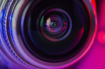 .Camera lens and backlight in blue and red.