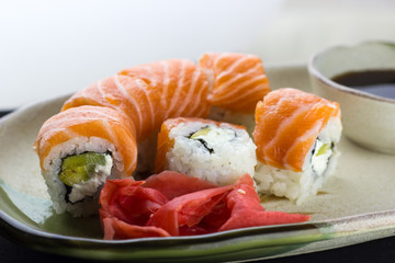 Philadelphia roll sushi with salmon, smoked eel, cucumber, avocado, cream cheese. Sushi menu. Japanese food.