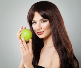 Healthy Woman Smiling and Holding Green Apple Fruit. Healthy Eating and Diet Concept