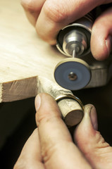 Fototapeta premium Craft jewelery making. Ring polishing. Macro shot.