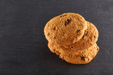 Chocolate chips cookies isolated on black background, macro, close-up, shallow depth of field