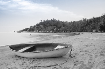 Black and white Beautiful beach with motor boat at toa island, Thailand