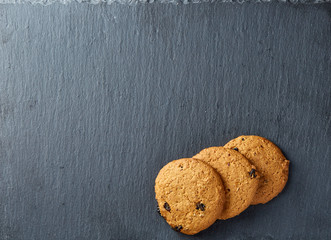 Chocolate chips cookies isolated on black background, macro, close-up