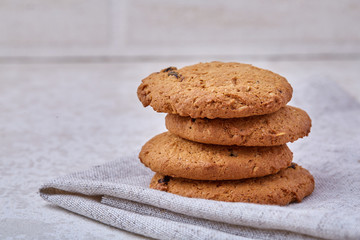 Chocolate chips cookies isolated on light background, macro, close-up, shallow depth of field, selective focus