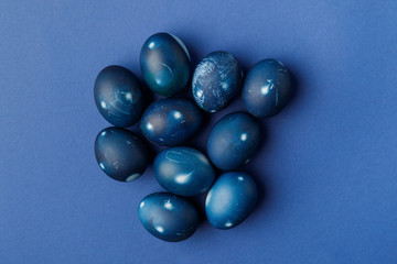 Top view of blue painted easter eggs on blue