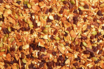 Granola texture, muesli texture, a top view close photo image on granola or muesli pile present a detail in top view of granola or muesli texture, a cereal grain healthy food, can use for background