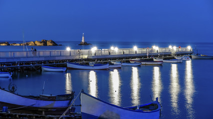 Ahtopol Bulgaria lighthouse and a pier at night