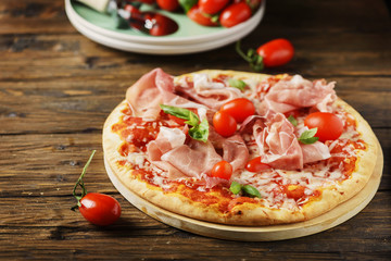 Italian pizza with mozzarella, tomato and bacon